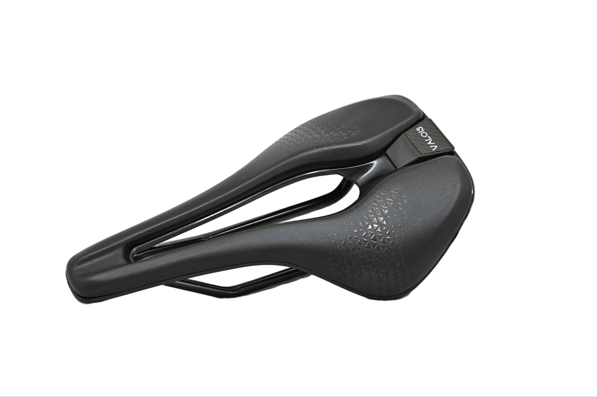Valois Vael road saddle, three-quarter view showing the textured top and central cutout