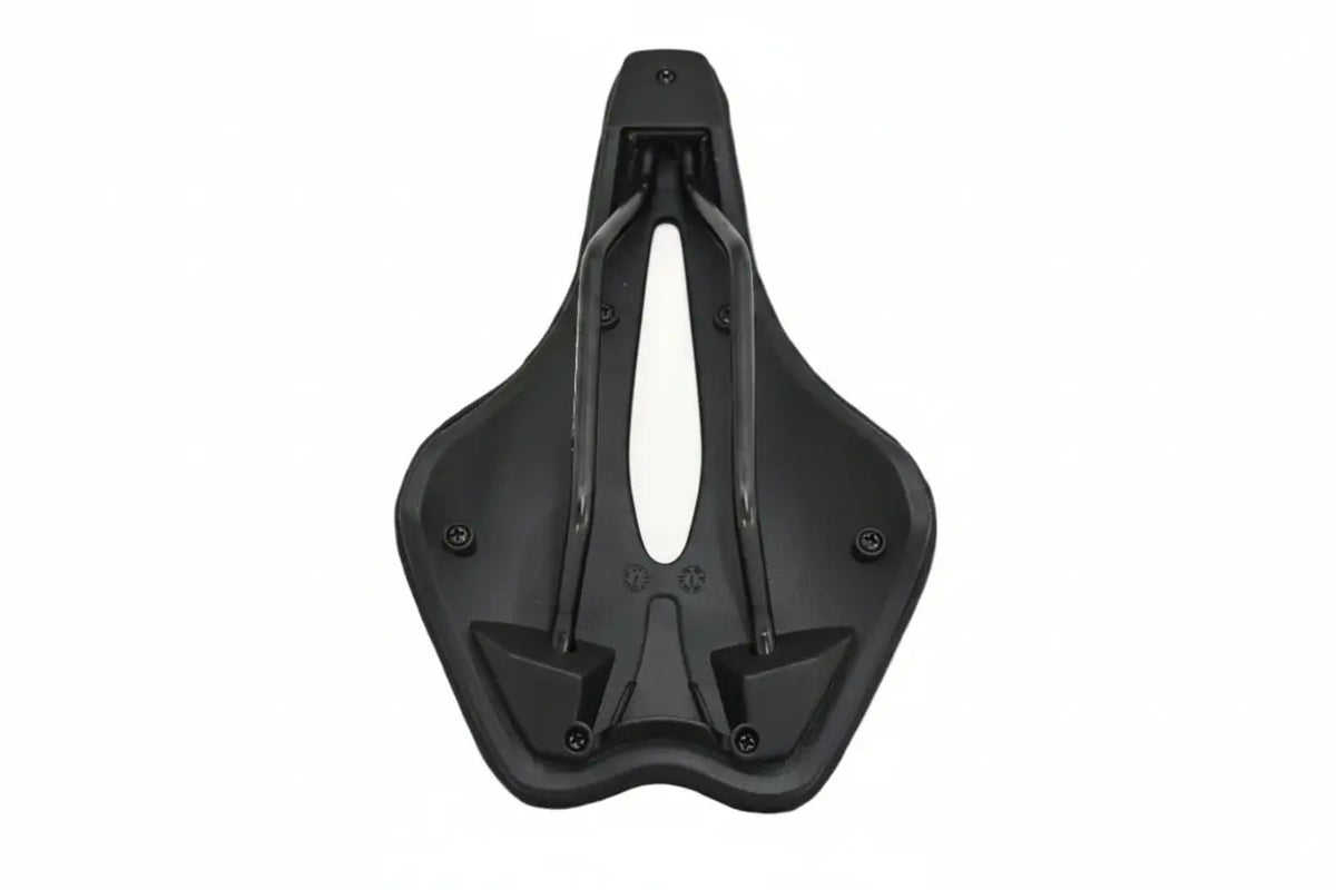 Valois Kulkia saddle from underneath, showing the shell and rail mounts