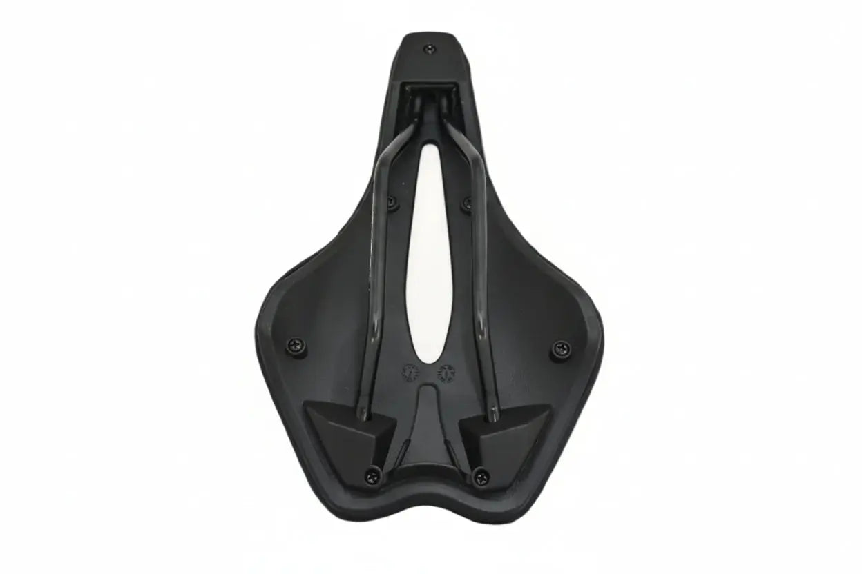 Valois Kulkia saddle from underneath, showing the shell and rail mounts