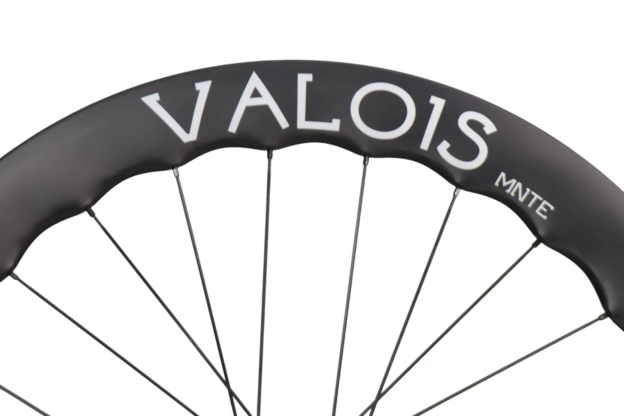 Valois MNTE 60 rim close-up showing the VALOIS MNTE logo on matte carbon